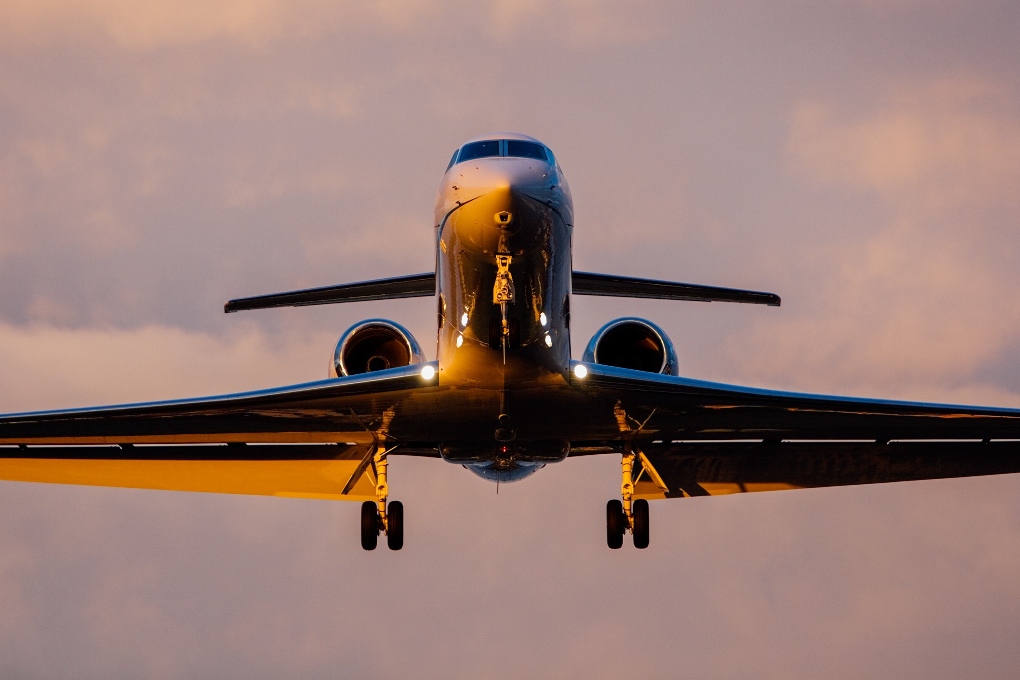 Business jet departing from snowy runway